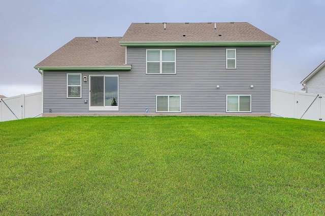 1221 136th St W, Rosemount, MN 55068 - back of property with a fenced backyard and a shingled roof