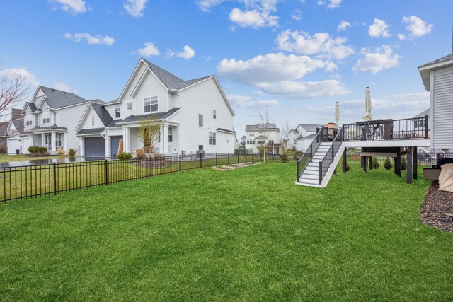 10914 23rd St NE, Saint Michael, MN 55376 - fenced backyard featuring a residential view, a garage, a wooden deck, and stairway