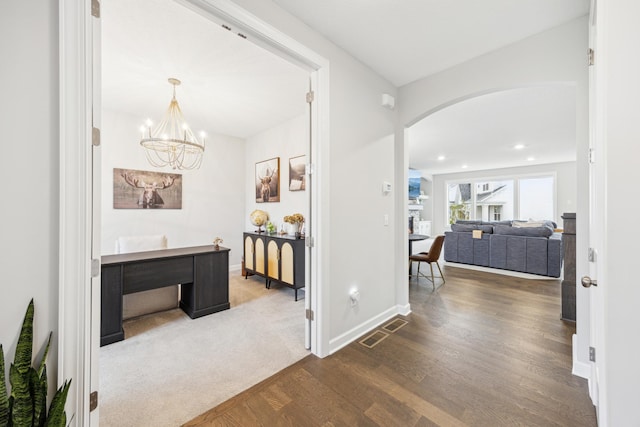 10914 23rd St NE, Saint Michael, MN 55376 - hall featuring arched walkways, wood finished floors, a chandelier, and recessed lighting