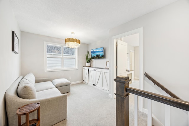 10914 23rd St NE, Saint Michael, MN 55376 - living room featuring light carpet, a chandelier, and a textured ceiling