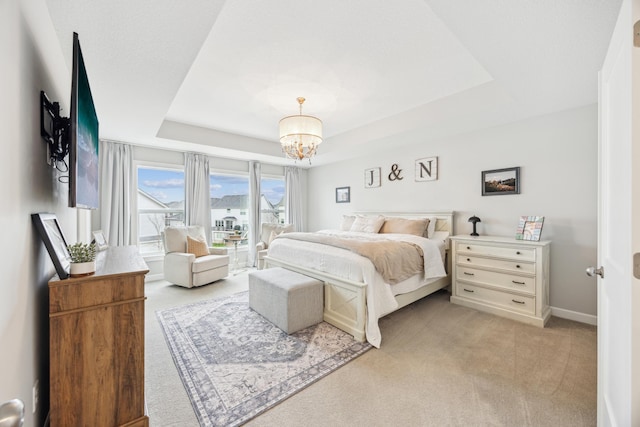 10914 23rd St NE, Saint Michael, MN 55376 - bedroom with light carpet, a raised ceiling, and a chandelier