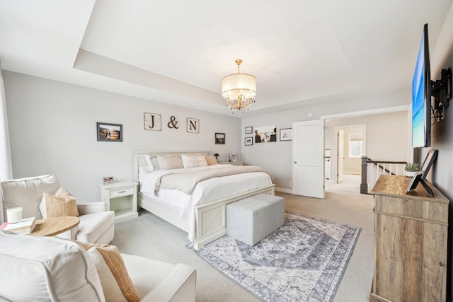 10914 23rd St NE, Saint Michael, MN 55376 - bedroom with light carpet, a tray ceiling, and a chandelier