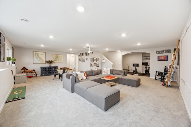 10914 23rd St NE, Saint Michael, MN 55376 - carpeted living area with recessed lighting, stairs, and arched walkways