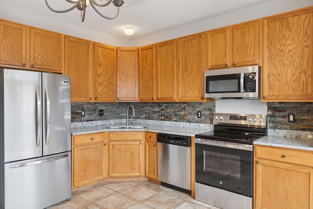 7829 Elm Grove Ln, New Hope, MN 55428 - kitchen with appliances with stainless steel finishes, decorative backsplash, light tile patterned floors, and light stone counters