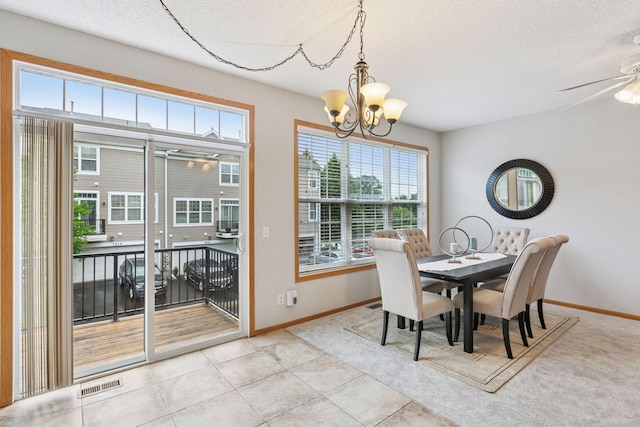 7829 Elm Grove Ln, New Hope, MN 55428 - dining area featuring ceiling fan, plenty of natural light, a textured ceiling, a chandelier, and light tile patterned flooring