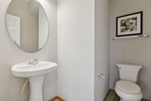 7829 Elm Grove Ln, New Hope, MN 55428 - half bath with toilet and wood finished floors