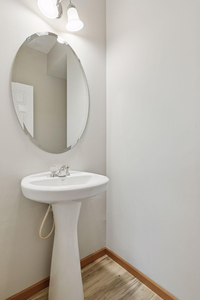 7829 Elm Grove Ln, New Hope, MN 55428 - bathroom with wood finished floors and a sink