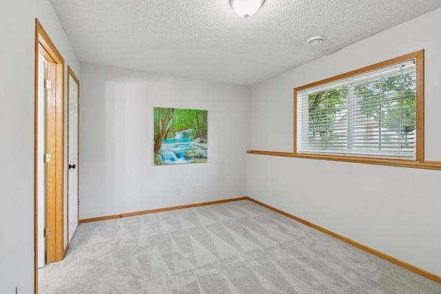 7829 Elm Grove Ln, New Hope, MN 55428 - unfurnished bedroom featuring carpet and a textured ceiling