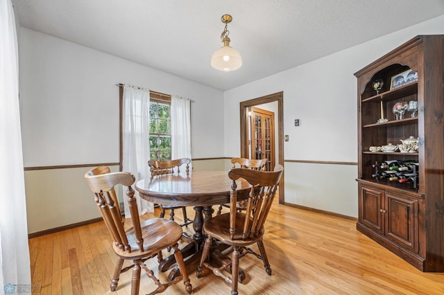 1330 12th St N, Fargo, ND 58102 - dining room with light wood-style floors and baseboards