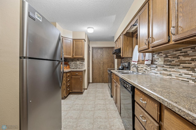 1330 12th St N, Fargo, ND 58102 - kitchen with freestanding refrigerator, dishwasher, backsplash, range with electric stovetop, and brown cabinets