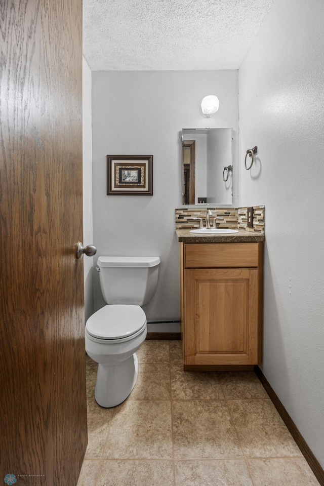1330 12th St N, Fargo, ND 58102 - half bath featuring vanity and a textured ceiling