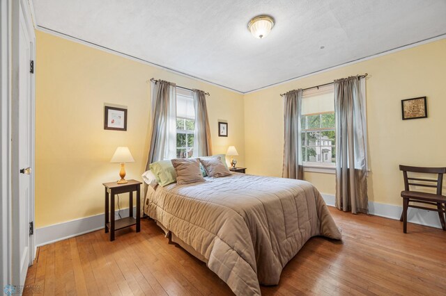 1330 12th St N, Fargo, ND 58102 - bedroom with multiple windows and hardwood / wood-style floors