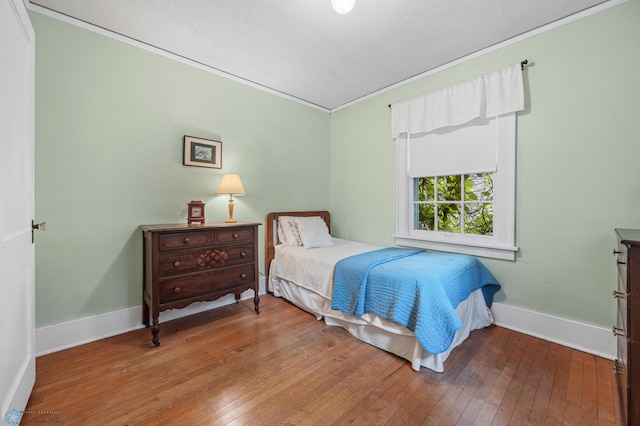 1330 12th St N, Fargo, ND 58102 - bedroom featuring wood-type flooring and ornamental molding