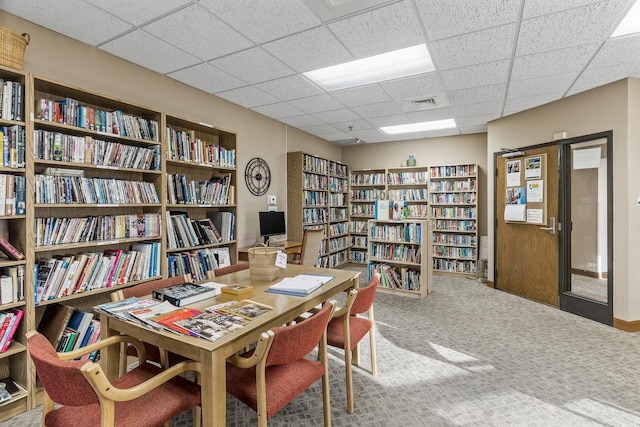 6615 Lake Shore Dr S Unit 803, Richfield, MN 55423 - carpeted home office featuring bookshelves and a paneled ceiling
