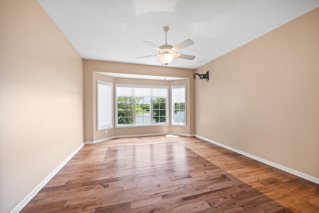 1215 Shore Dr SW, Hutchinson, MN 55350 - empty room with wood finished floors and ceiling fan