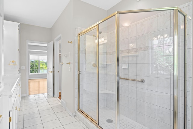 1215 Shore Dr SW, Hutchinson, MN 55350 - full bath with vanity, tile patterned floors, and a shower stall