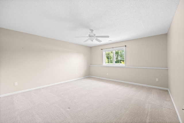 1215 Shore Dr SW, Hutchinson, MN 55350 - empty room featuring a ceiling fan, carpet flooring, and a textured ceiling