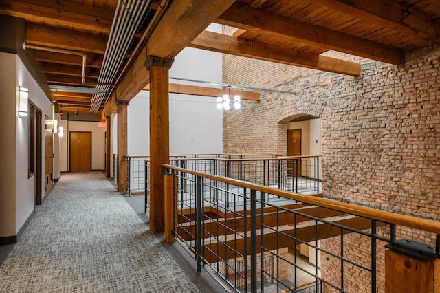 400 1st St Unit 502, Minneapolis, MN 55401 - hallway with an upstairs landing and a wood ceiling with exposed beams