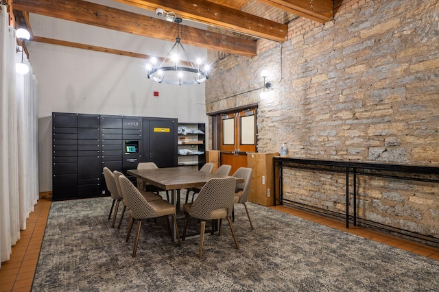 400 1st St Unit 502, Minneapolis, MN 55401 - tiled dining room featuring beamed ceiling, a high ceiling, and a chandelier