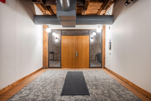 400 1st St Unit 502, Minneapolis, MN 55401 - below grade area featuring tile patterned floors and wooden ceiling