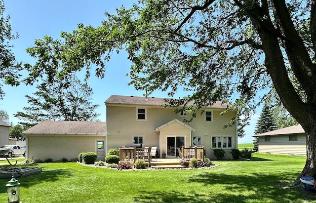 515 2nd St SW, New Richland, MN 56072 - rear view of house with a wooden deck and a lawn