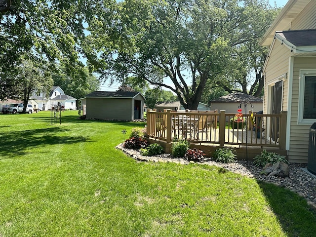 515 2nd St SW, New Richland, MN 56072 - view of green lawn featuring a wooden deck