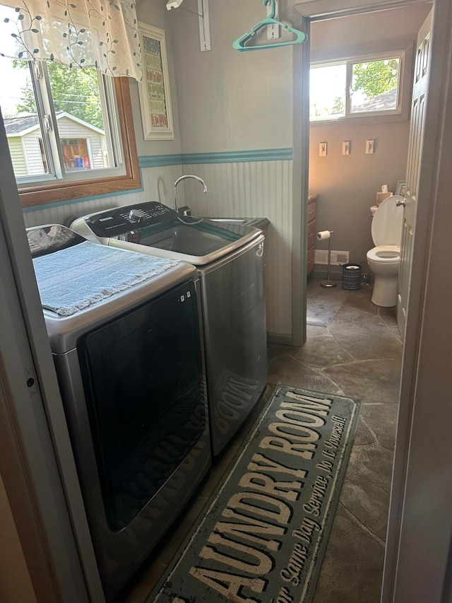 515 2nd St SW, New Richland, MN 56072 - washroom with washing machine and dryer and a wainscoted wall