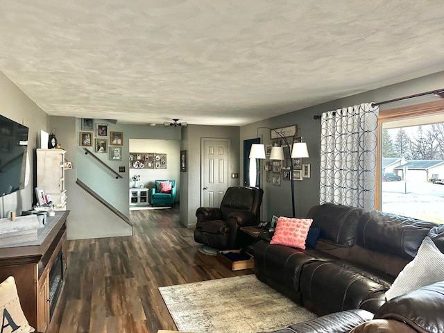 515 2nd St SW, New Richland, MN 56072 - living room with wood finished floors, a textured ceiling, and stairway