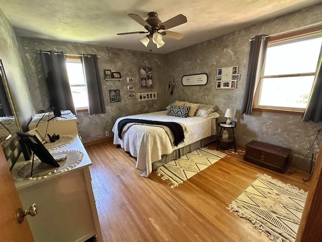 515 2nd St SW, New Richland, MN 56072 - bedroom with wood finished floors and a ceiling fan