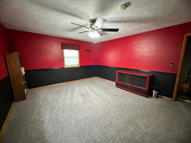 515 2nd St SW, New Richland, MN 56072 - unfurnished bedroom with carpet floors and ceiling fan