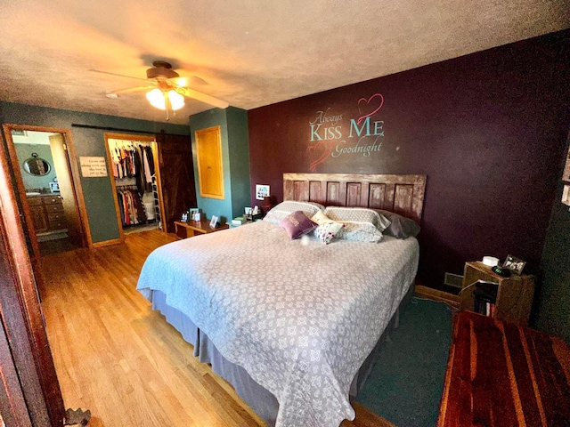 515 2nd St SW, New Richland, MN 56072 - bedroom featuring wood finished floors, a closet, and ceiling fan