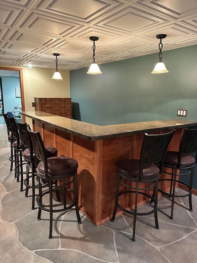 515 2nd St SW, New Richland, MN 56072 - indoor bar with an ornate ceiling, hanging light fixtures, and concrete floors
