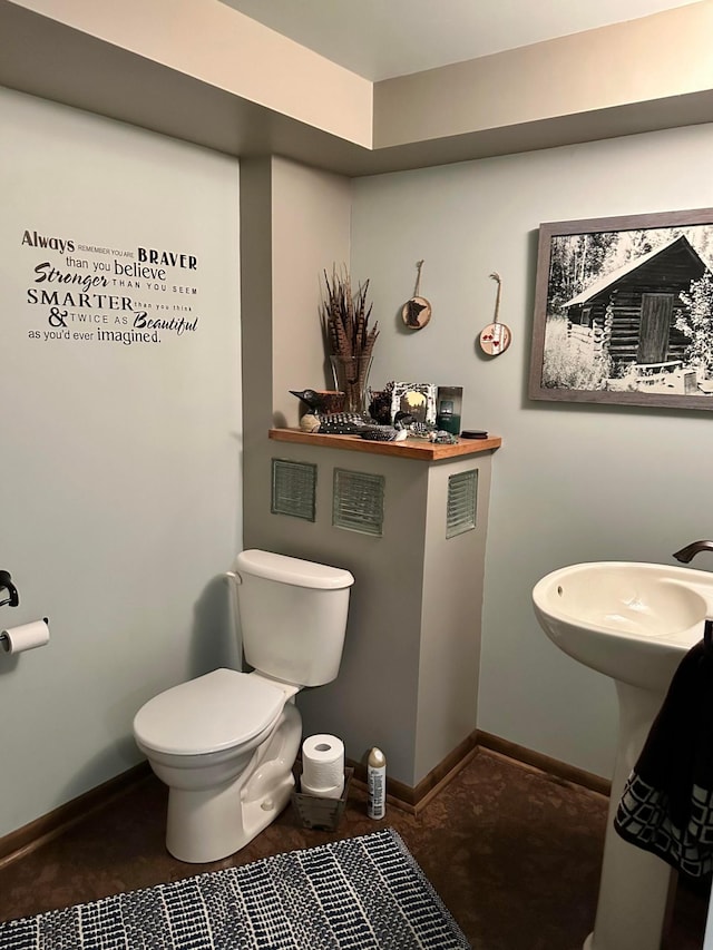 515 2nd St SW, New Richland, MN 56072 - bathroom with toilet and baseboards