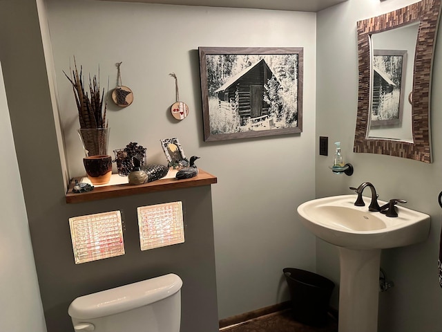 515 2nd St SW, New Richland, MN 56072 - bathroom with toilet and a sink