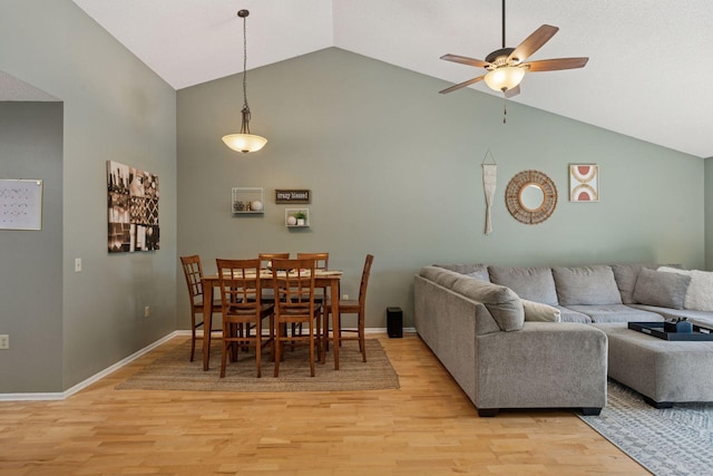 7140 Ivy Ridge Ct, Lino Lakes, MN 55014 - dining area with high vaulted ceiling, a ceiling fan, and light wood-style flooring
