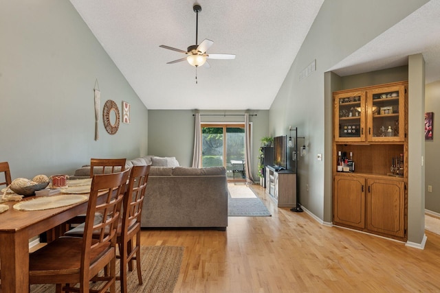7140 Ivy Ridge Ct, Lino Lakes, MN 55014 - dining room with ceiling fan, light wood finished floors, and high vaulted ceiling