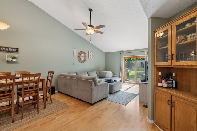 7140 Ivy Ridge Ct, Lino Lakes, MN 55014 - living area featuring ceiling fan, light wood-style floors, and high vaulted ceiling