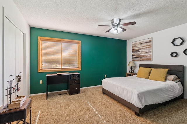 7140 Ivy Ridge Ct, Lino Lakes, MN 55014 - carpeted bedroom with a textured ceiling, ceiling fan, and a closet