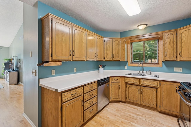 7140 Ivy Ridge Ct, Lino Lakes, MN 55014 - kitchen with appliances with stainless steel finishes, a textured ceiling, light wood-type flooring, brown cabinets, and light countertops