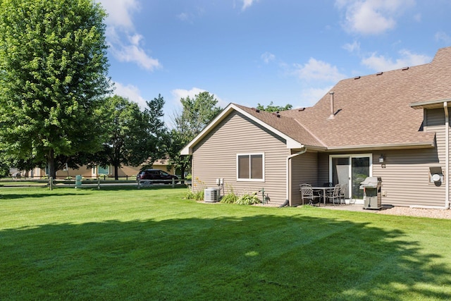 7140 Ivy Ridge Ct, Lino Lakes, MN 55014 - back of house featuring roof with shingles and a patio area