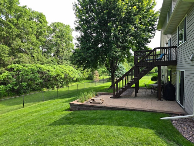 100 Barkley Cir W, Cannon Falls, MN 55009 - view of yard with stairway, a patio area, a deck, and view of wooded area