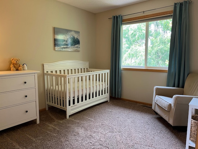 100 Barkley Cir W, Cannon Falls, MN 55009 - carpeted bedroom featuring a crib and baseboards