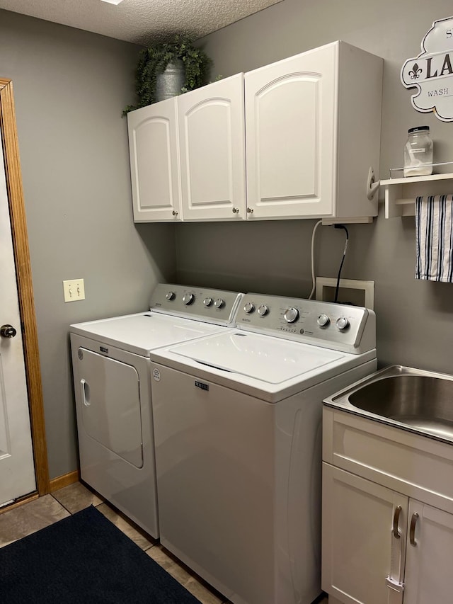 100 Barkley Cir W, Cannon Falls, MN 55009 - laundry room with independent washer and dryer, cabinet space, and light tile patterned floors