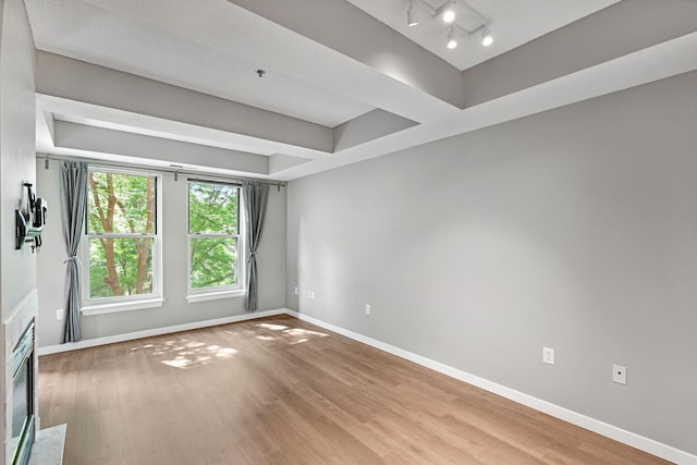645 1st St Unit 305, Minneapolis, MN 55401 - spare room featuring baseboards and wood finished floors