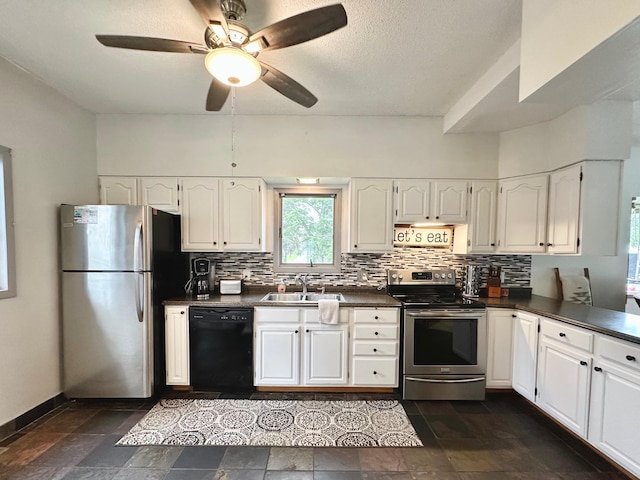 511 3rd St, Nashwauk, MN 55769 - kitchen featuring appliances with stainless steel finishes, dark countertops, decorative backsplash, white cabinets, and a textured ceiling