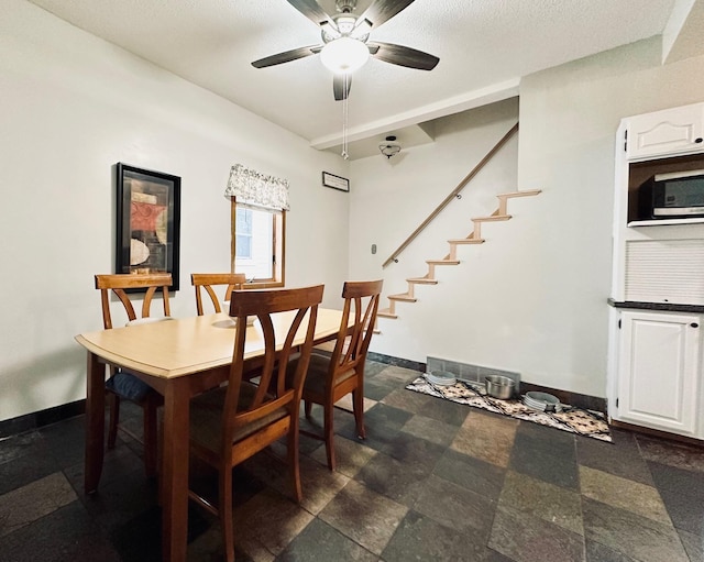 511 3rd St, Nashwauk, MN 55769 - dining room with a ceiling fan and stairway