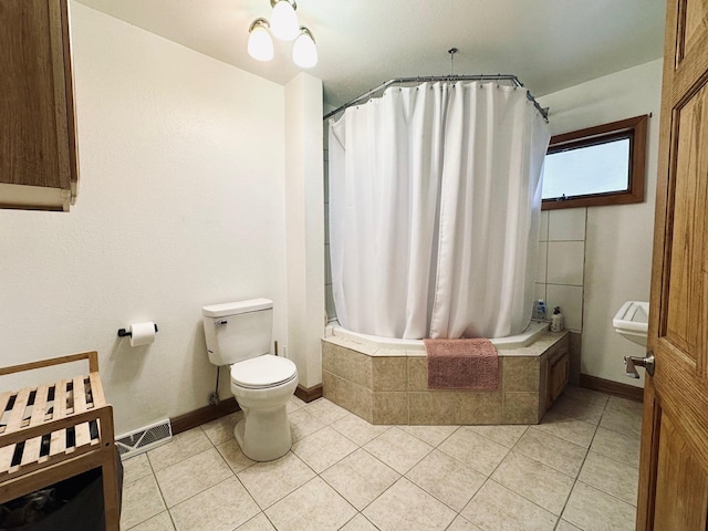 511 3rd St, Nashwauk, MN 55769 - bathroom with tiled shower / bath combo and tile patterned floors