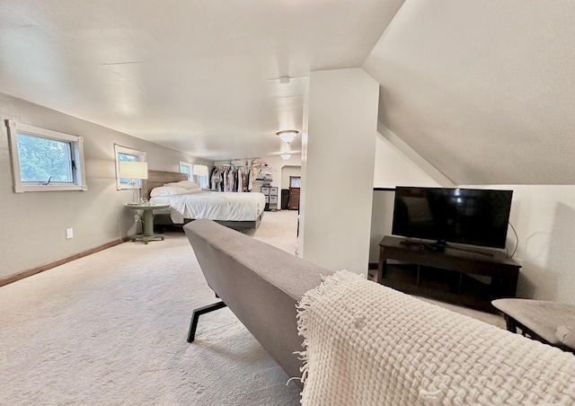 511 3rd St, Nashwauk, MN 55769 - carpeted bedroom with lofted ceiling and baseboards