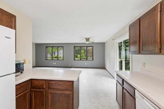 812 Ivanhoe Dr, Northfield, MN 55057 - kitchen featuring white appliances, ceiling fan, light countertops, and a peninsula