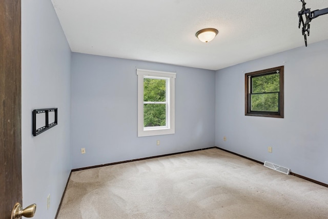 812 Ivanhoe Dr, Northfield, MN 55057 - carpeted empty room featuring baseboards